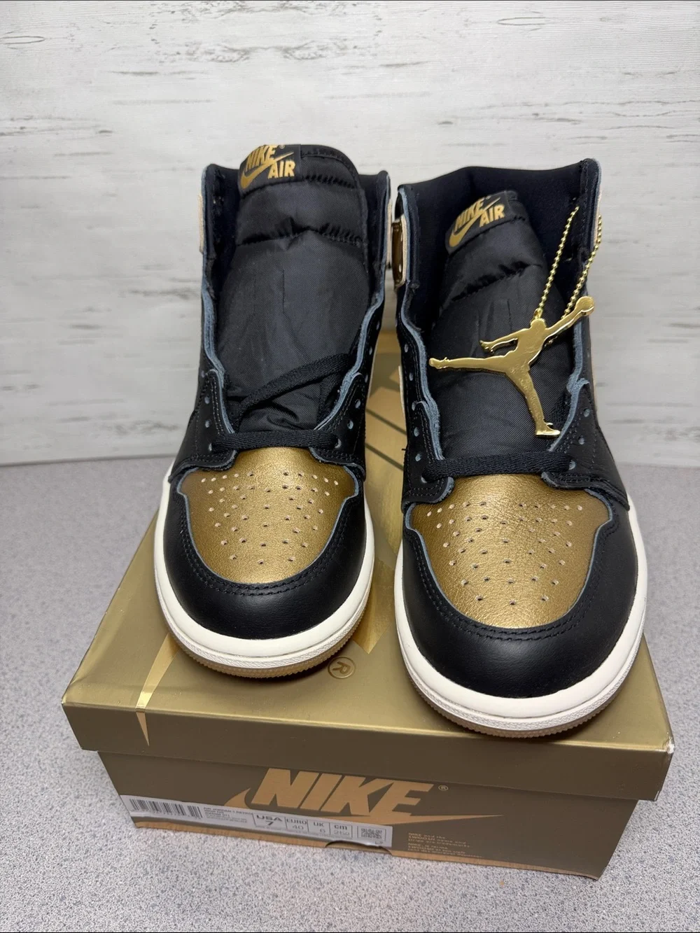 Jordan High-Top Sneakers in Black and Metallic Gold